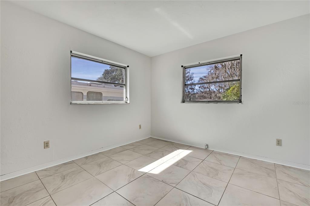 12130 Maple Street Dunnellon, FL 34432 - Photo 33 of 54 a view of an empty room with a window