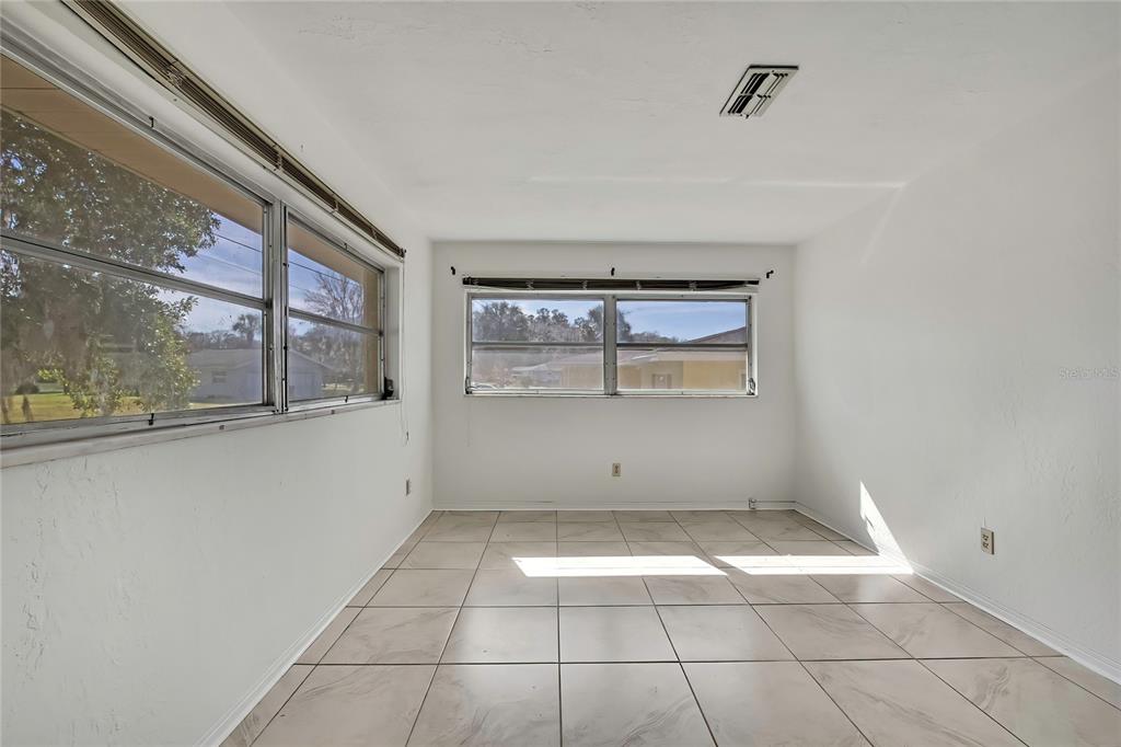 12130 Maple Street Dunnellon, FL 34432 - Photo 34 of 54 a view of an empty room with a window