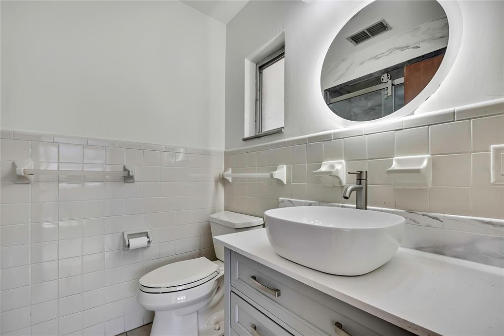 12130 Maple Street Dunnellon, FL 34432 - Photo 35 of 54 a bathroom with a sink and a mirror