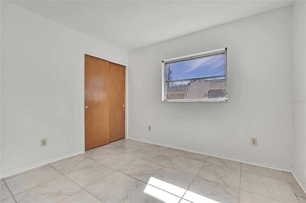 12130 Maple Street Dunnellon, FL 34432 - Photo 38 of 54 a view of an empty room with a window