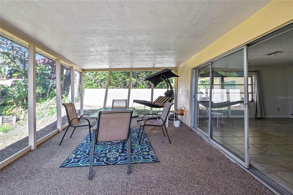 12130 Maple Street Dunnellon, FL 34432 - Photo 41 of 54 a dining room with furniture and wooden floor