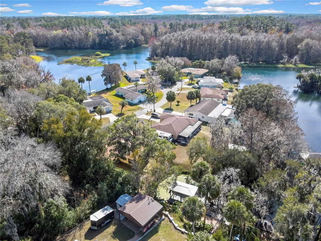 12130 Maple Street Dunnellon, FL 34432 - Photo 50 of 54 a view of a lake with a house