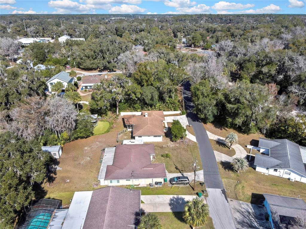 12130 Maple Street Dunnellon, FL 34432 - Photo 52 of 54 an aerial view of a house with yard