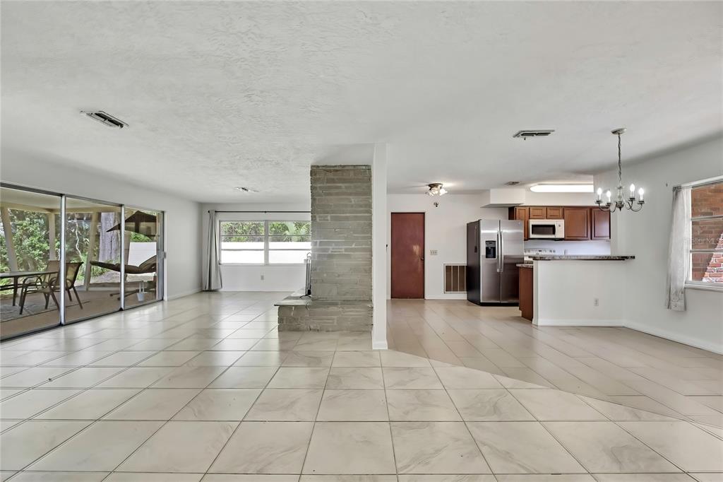 12130 Maple Street Dunnellon, FL 34432 - Photo 7 of 54 a large kitchen with cabinets and a kitchen