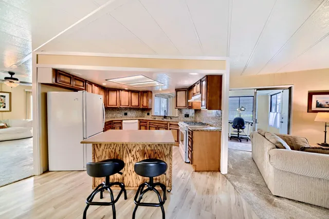 a view of a porch with a table and chairs