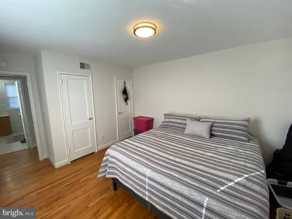 a bedroom with a bed and a walk in closet