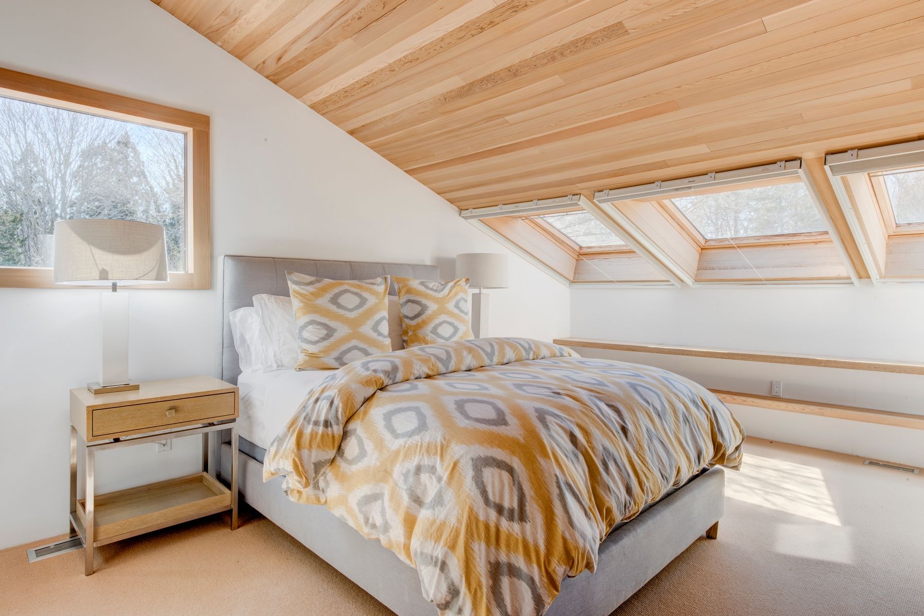 77 Cross Highway East Hampton, NY 11937 - Photo 11 of 17 a bedroom with a bed and window