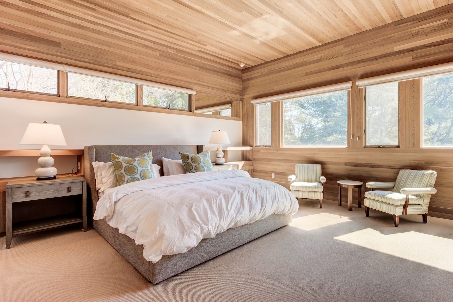 77 Cross Highway East Hampton, NY 11937 - Photo 12 of 17 a spacious bedroom with a bed and window