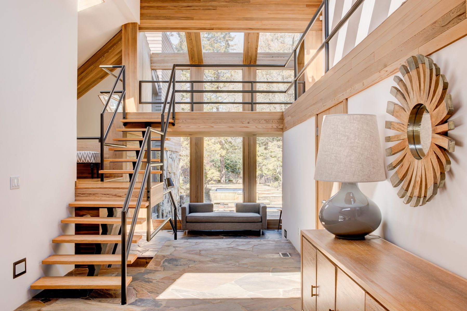 77 Cross Highway East Hampton, NY 11937 - Photo 2 of 17 a living room with furniture and a large window