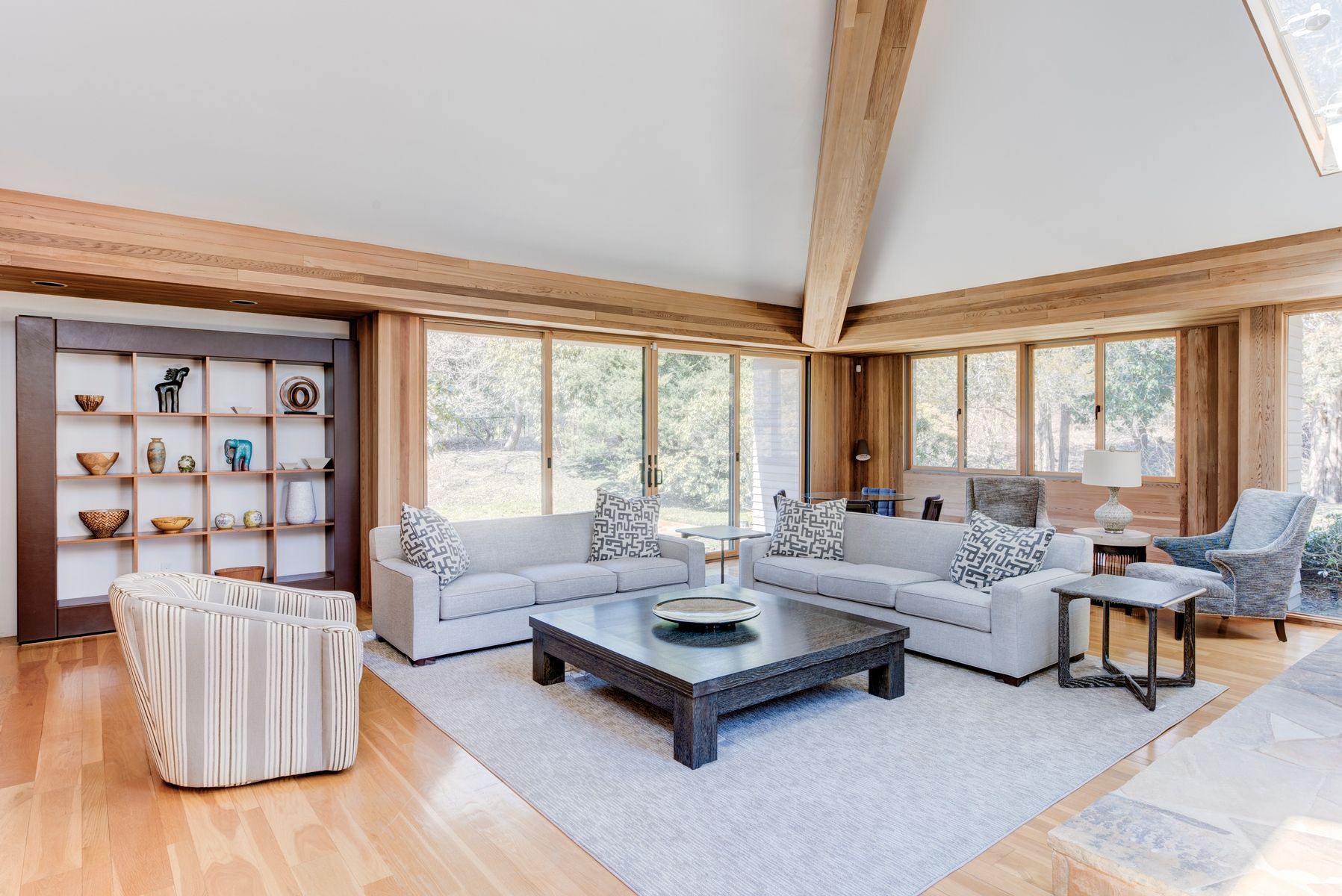 77 Cross Highway East Hampton, NY 11937 - Photo 4 of 17 a living room with furniture and a large window