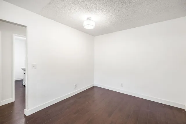 a kitchen with stainless steel appliances granite countertop a sink stove and microwave