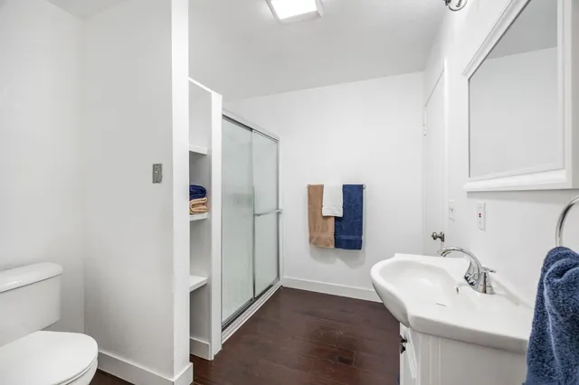a white toilet sitting next to a bathroom sink