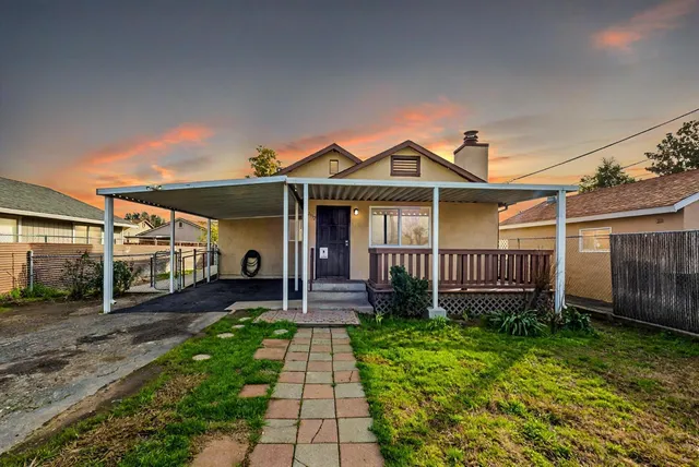 a front view of a house with garden