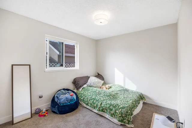 a view of a house with a wooden fence