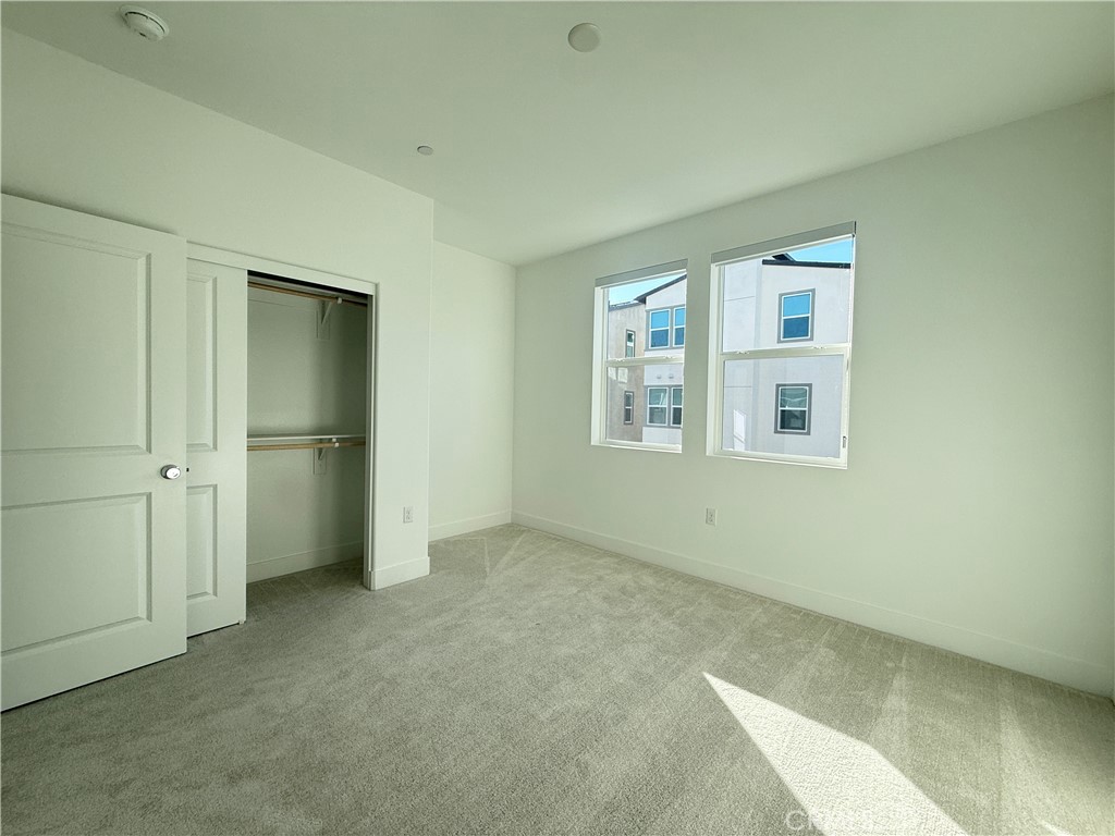 313 Proctor Irvine, CA 92618 - Photo 12 of 24 an empty room with windows and closet