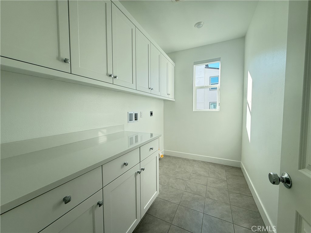 313 Proctor Irvine, CA 92618 - Photo 15 of 24 a room with a sink and cabinets