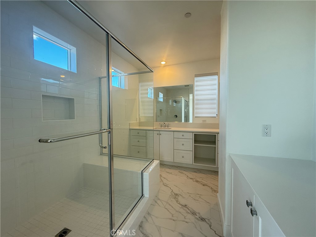 313 Proctor Irvine, CA 92618 - Photo 8 of 24 a bathroom with a shower a sink and a mirror
