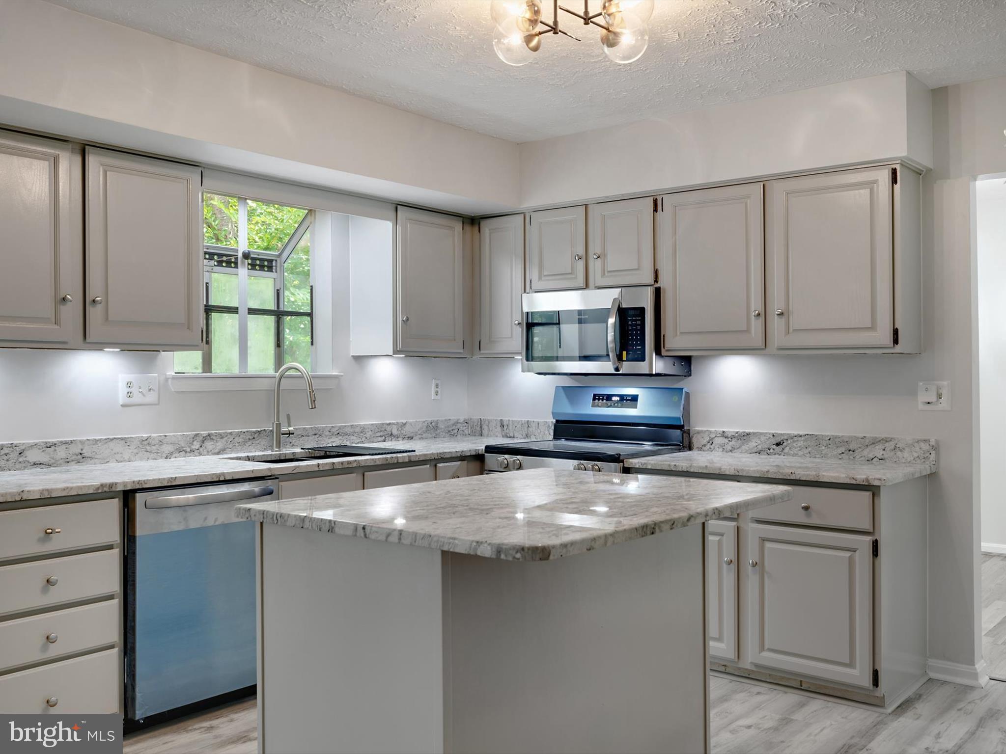 3228 Blackwalnut Drive Annapolis, MD 21403 - Photo 13 of 55 a kitchen with cabinets appliances a sink and a window