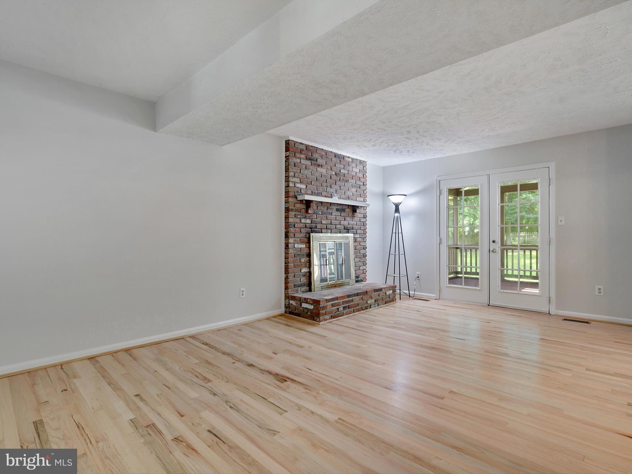 3228 Blackwalnut Drive Annapolis, MD 21403 - Photo 20 of 55 an empty room with wooden floor and windows