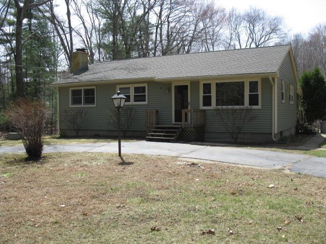 83 Luchon Road Willington, CT 06279 - Photo 1 of 1 a house with trees in front of it
