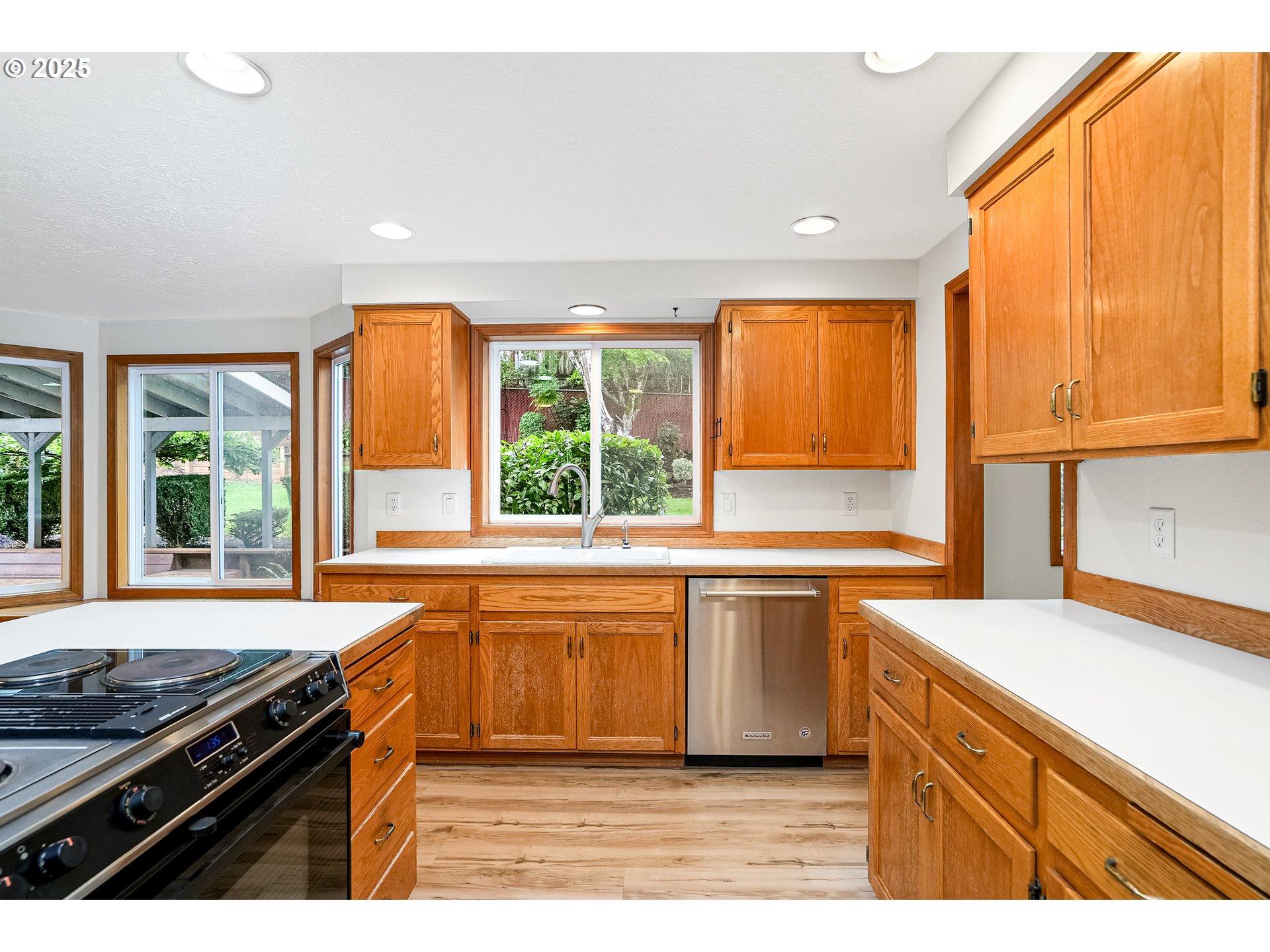 5561 Springwood Avenue Southeast Salem, OR 97306 - Photo 15 of 42 a kitchen with stainless steel appliances granite countertop a sink stove and refrigerator