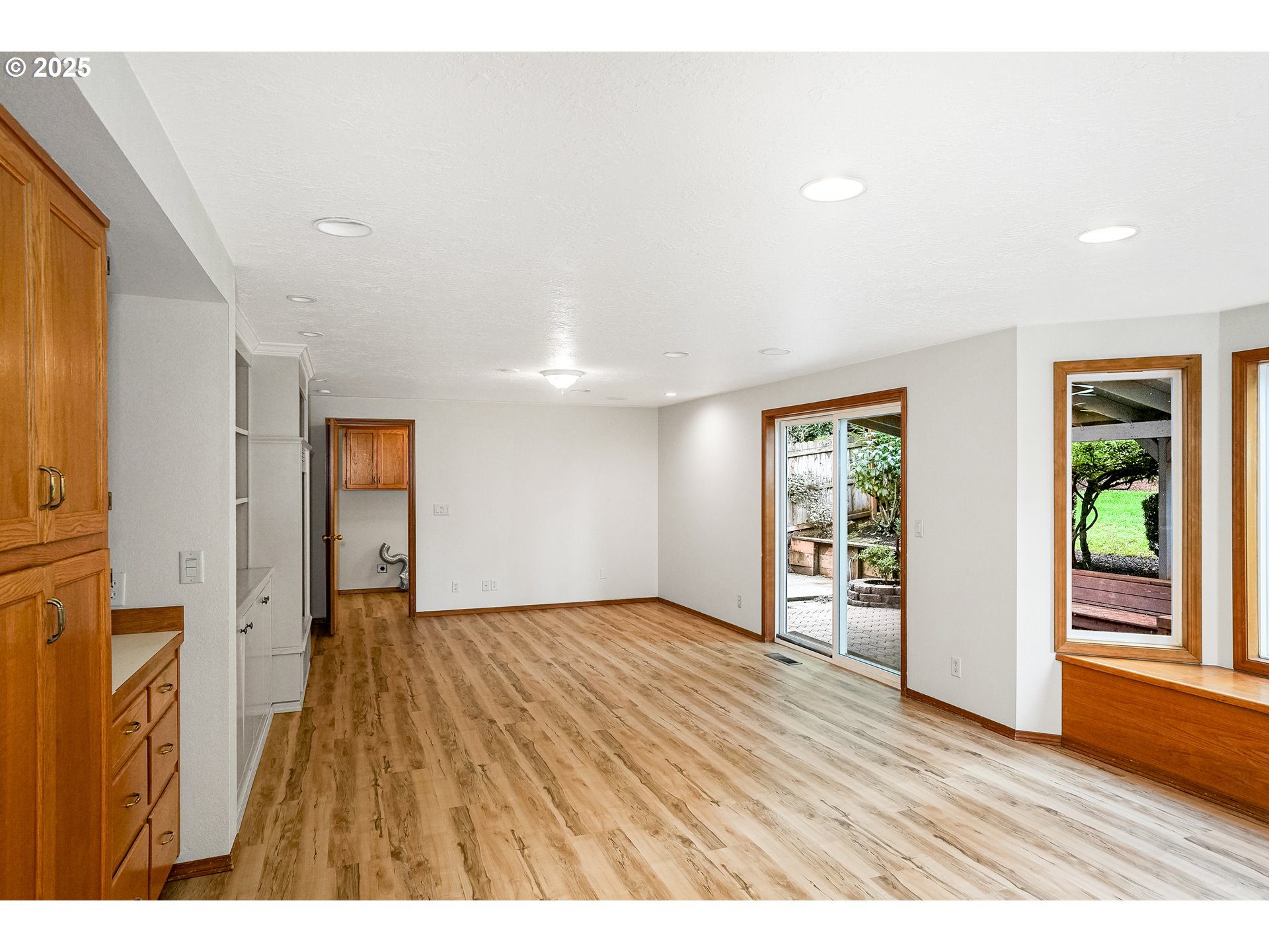 5561 Springwood Avenue Southeast Salem, OR 97306 - Photo 16 of 42 a view of an empty room with wooden floor and a window