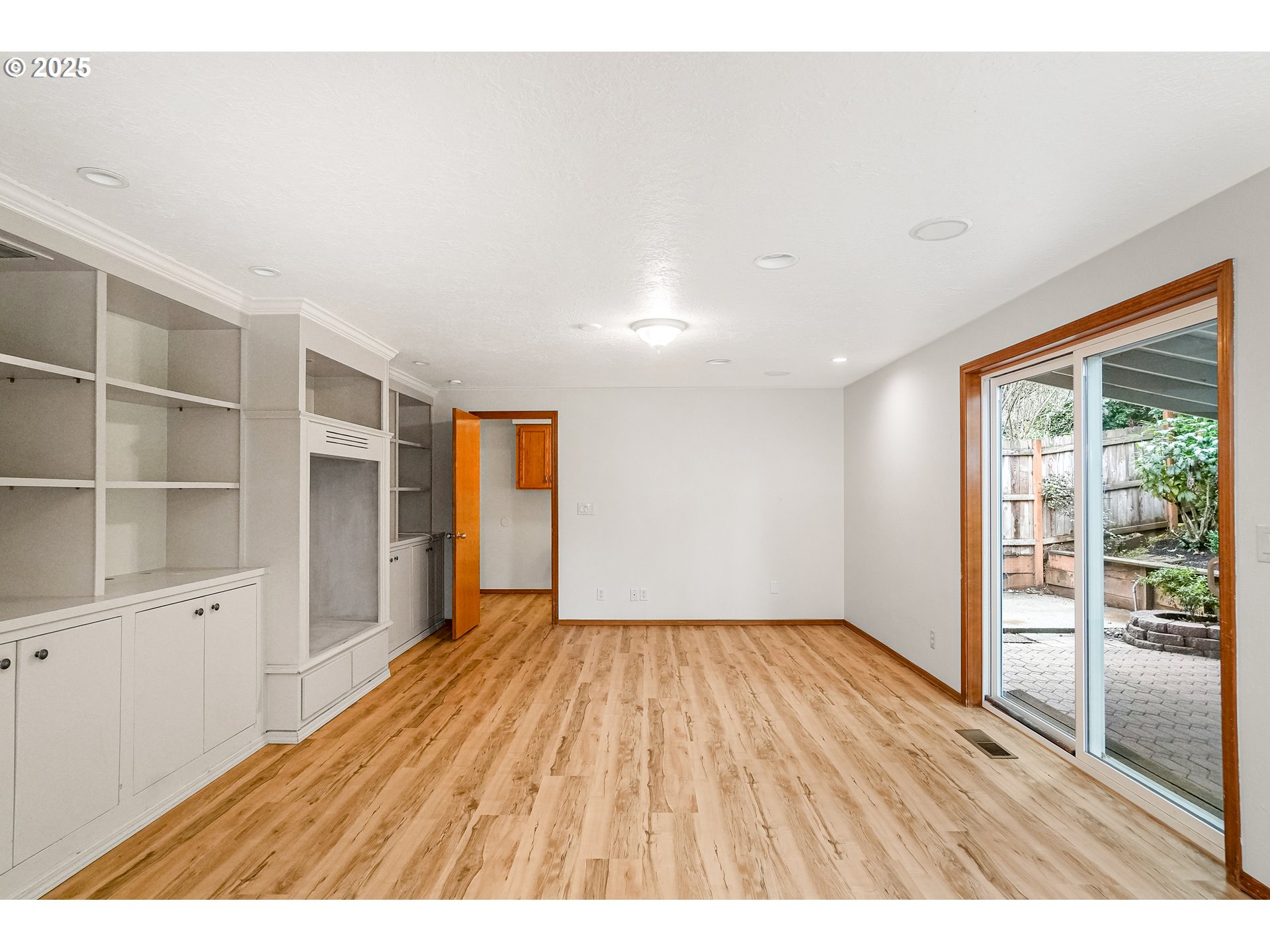 5561 Springwood Avenue Southeast Salem, OR 97306 - Photo 18 of 42 a view of an empty room with wooden floor and a window