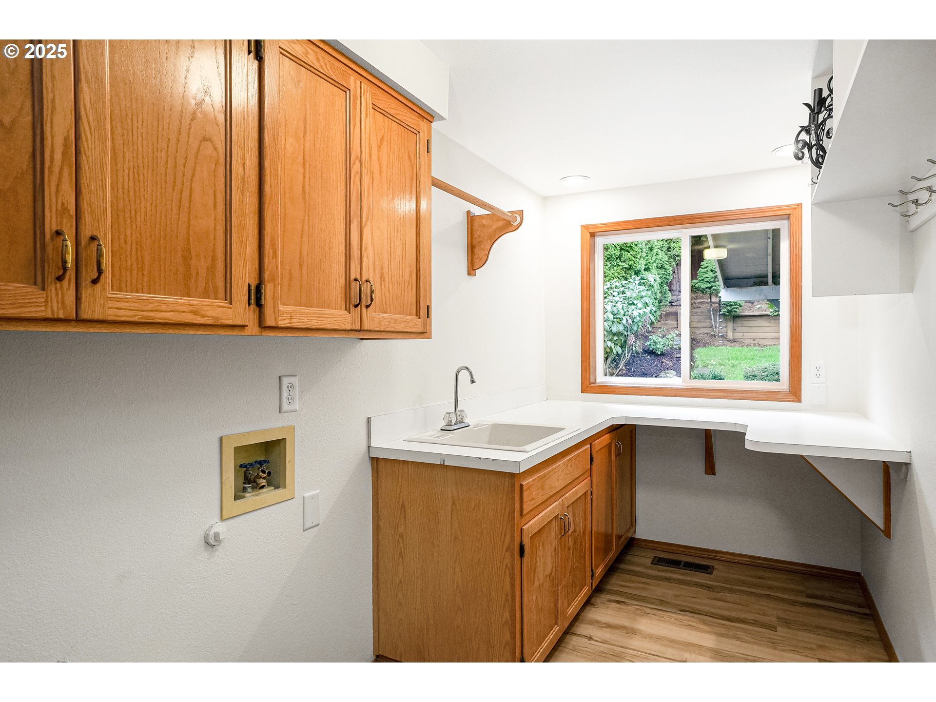 5561 Springwood Avenue Southeast Salem, OR 97306 - Photo 20 of 42 a kitchen with a sink a window and cabinets