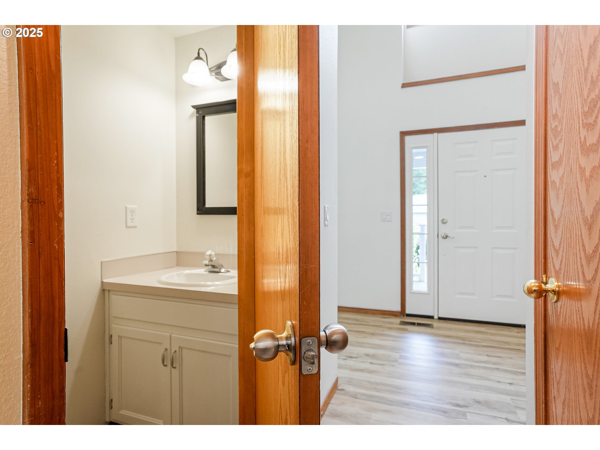 5561 Springwood Avenue Southeast Salem, OR 97306 - Photo 21 of 42 a bathroom with a granite countertop sink a mirror and a vanity