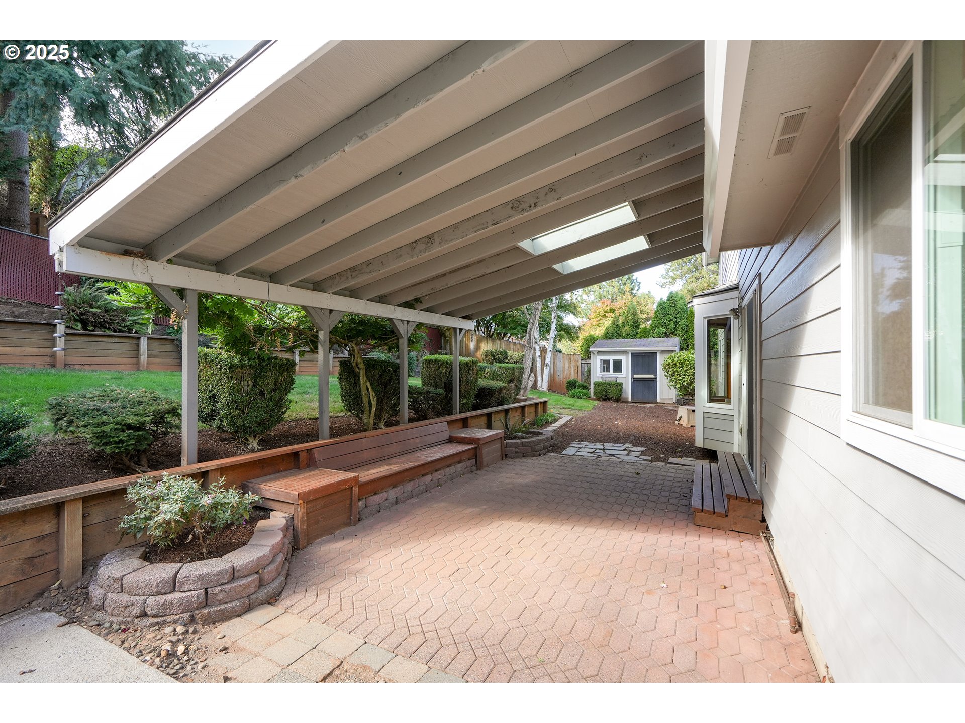 5561 Springwood Avenue Southeast Salem, OR 97306 - Photo 38 of 42 a view of a patio with table and chairs potted plants with wooden floor
