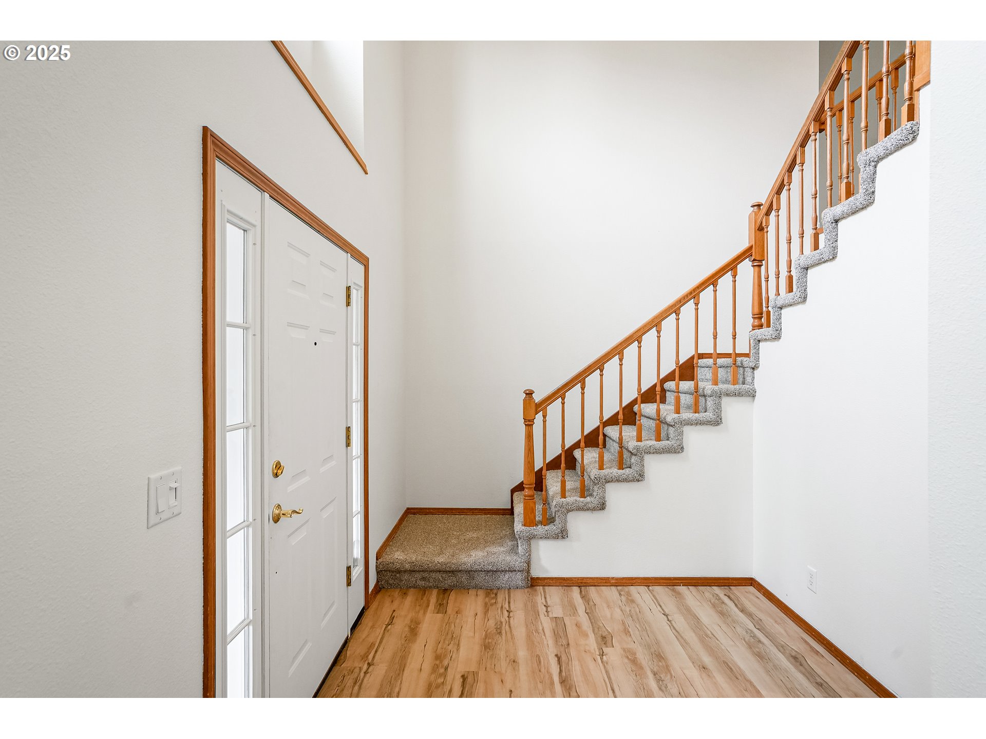 5561 Springwood Avenue Southeast Salem, OR 97306 - Photo 9 of 42 a view of staircase with wooden floor and a rug