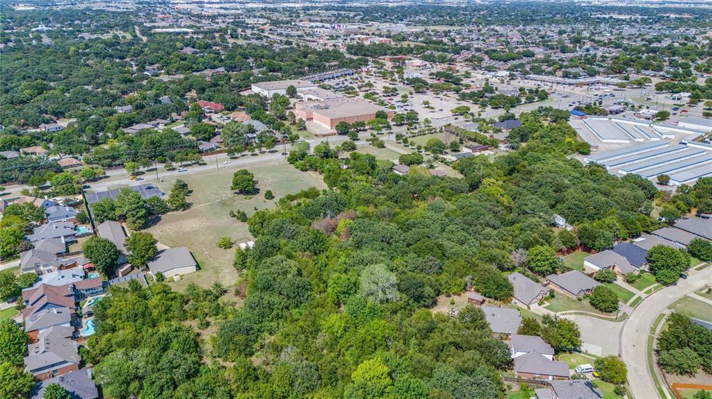2120 West Sublett Road Arlington, TX 76001 - Photo 3 of 12 an aerial view of residential houses with outdoor space and trees
