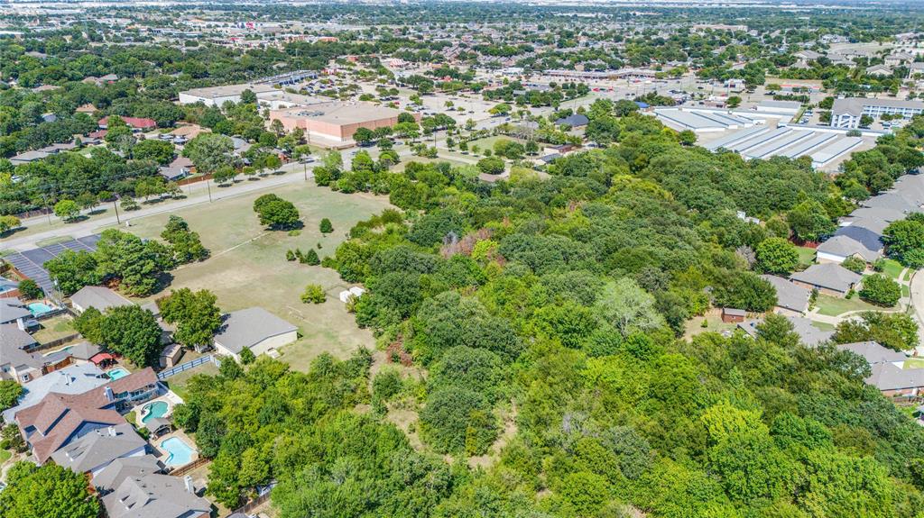 2120 West Sublett Road Arlington, TX 76001 - Photo 6 of 12 an aerial view of residential houses with outdoor space and trees