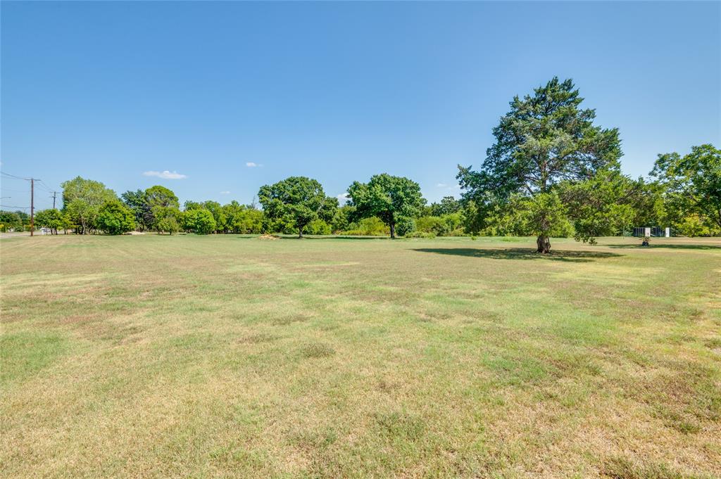 2120 West Sublett Road Arlington, TX 76001 - Photo 7 of 12 a view of yard with trees in the background