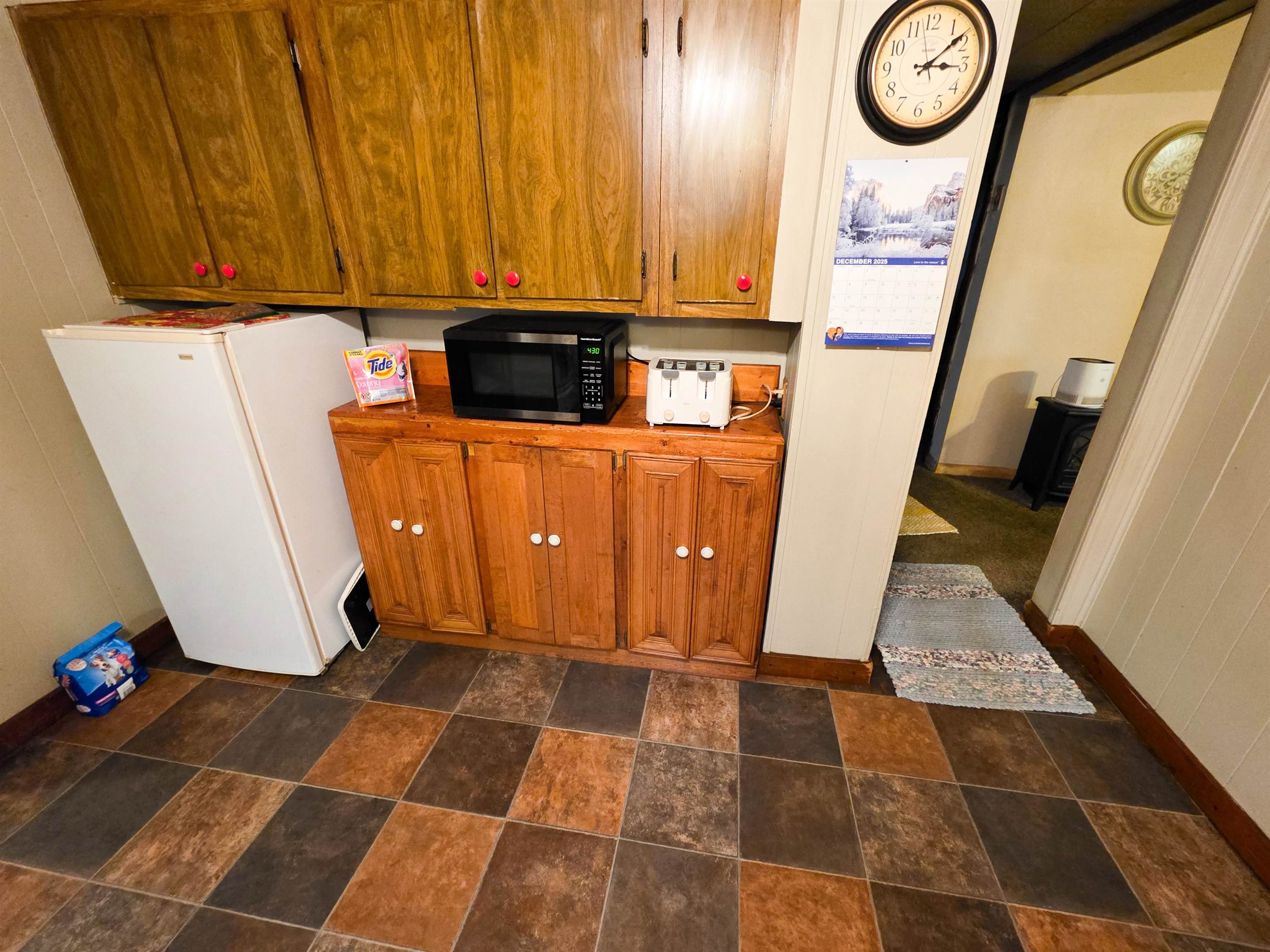 105 Watkins Street Cisne, IL 62823 - Photo 14 of 30 a view of a storage and utility room with a refrigerator