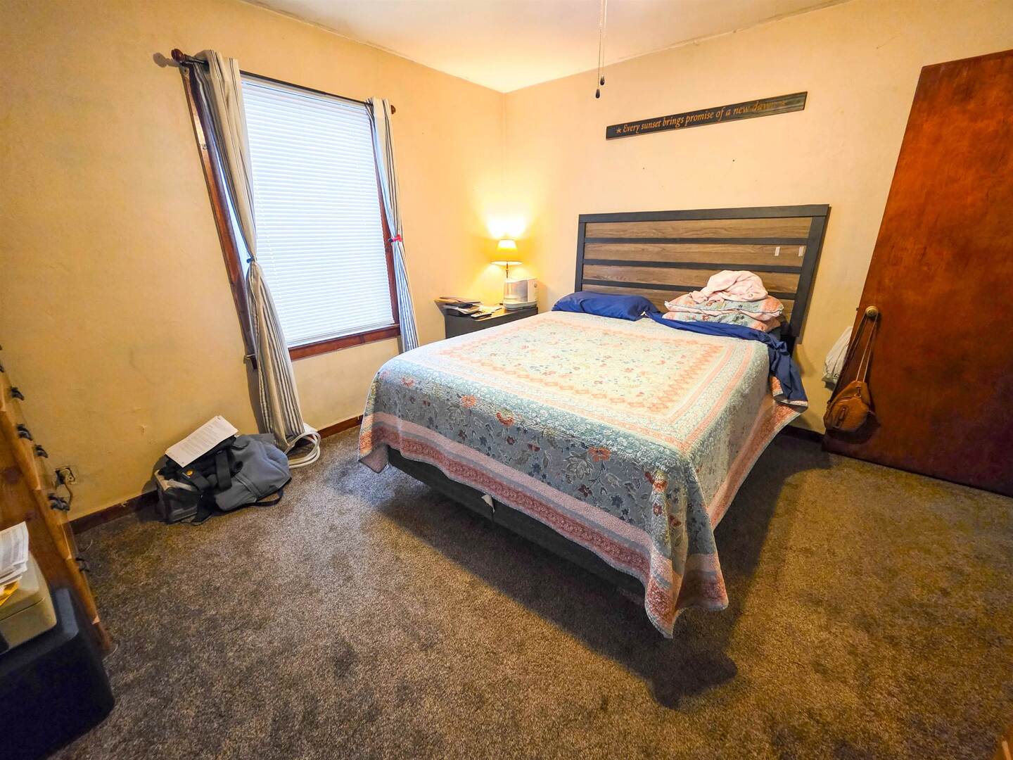 105 Watkins Street Cisne, IL 62823 - Photo 18 of 30 a bed sitting in a room next to a window