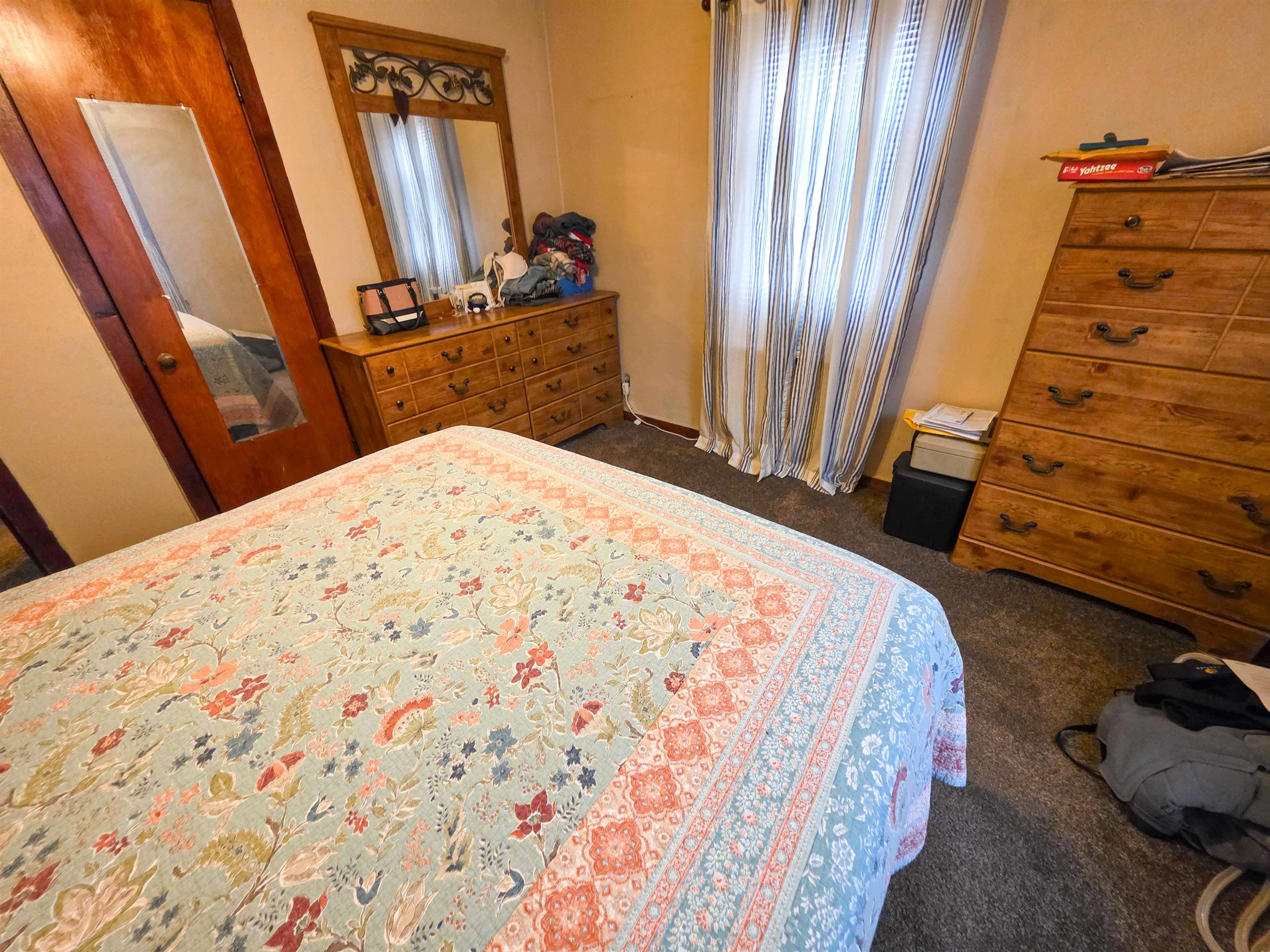 105 Watkins Street Cisne, IL 62823 - Photo 19 of 30 a bed sitting in a bedroom next to a window