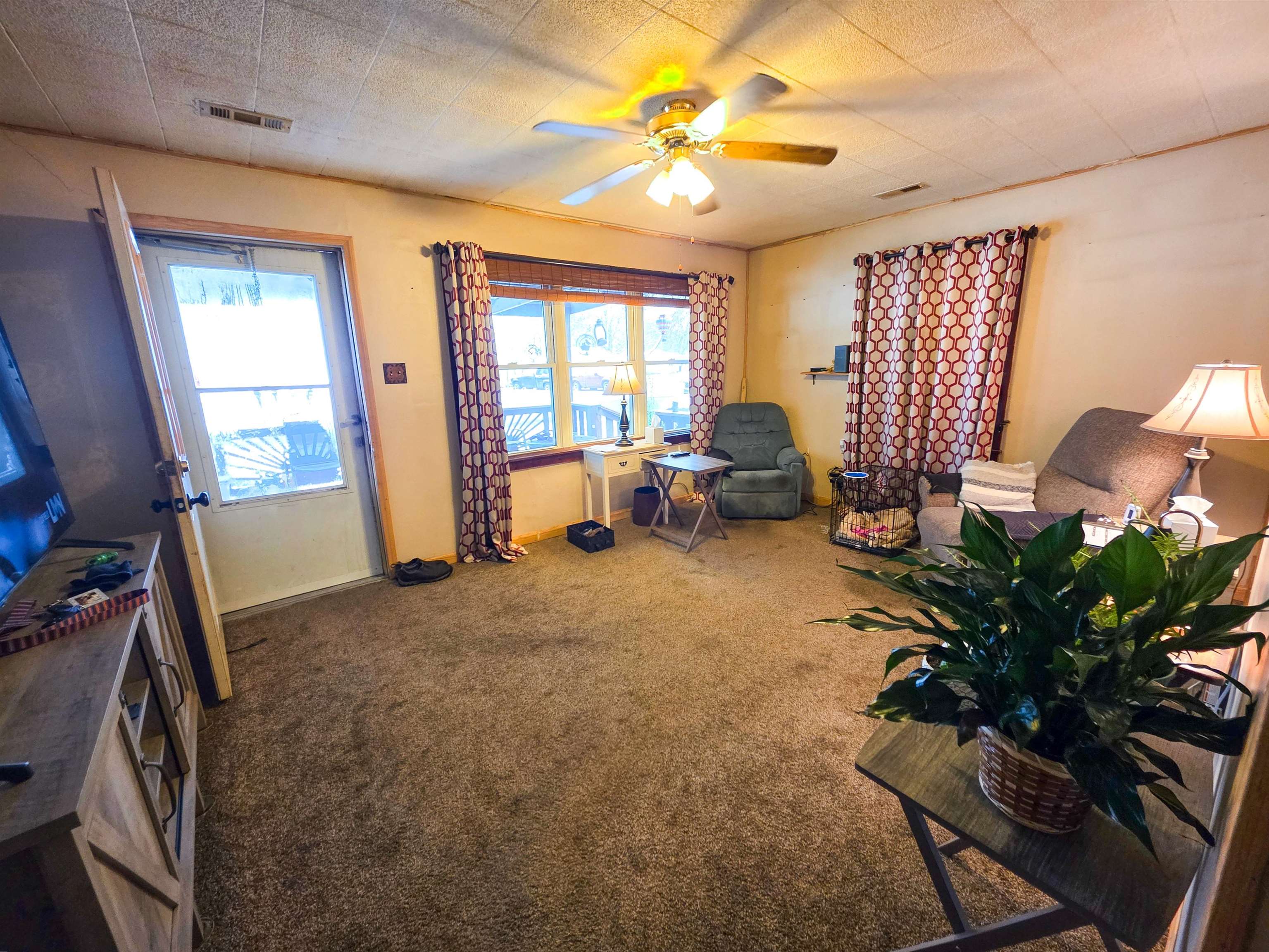 105 Watkins Street Cisne, IL 62823 - Photo 2 of 30 a living room with furniture and a large window