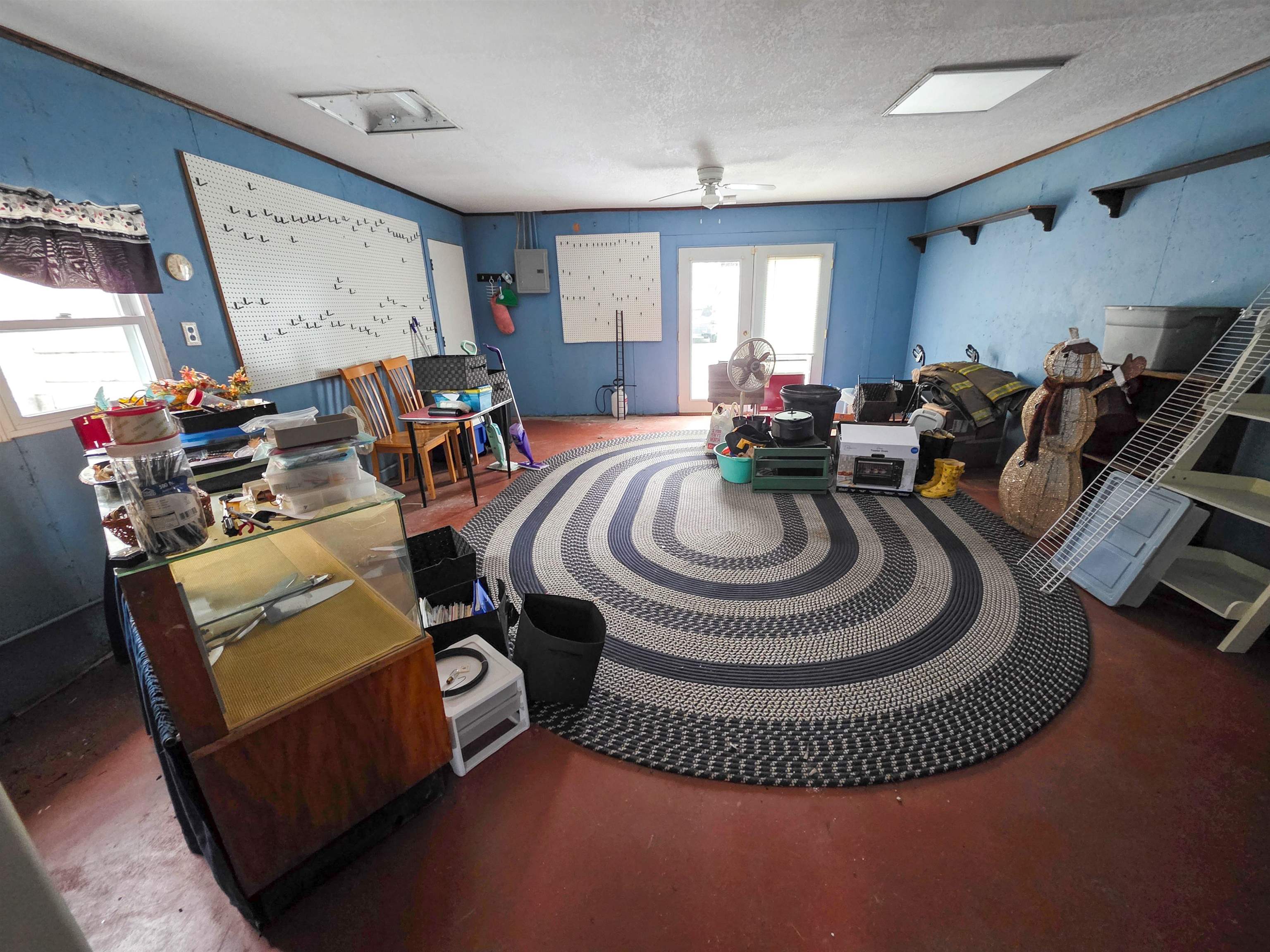 105 Watkins Street Cisne, IL 62823 - Photo 25 of 30 a living room with furniture a clock and a window