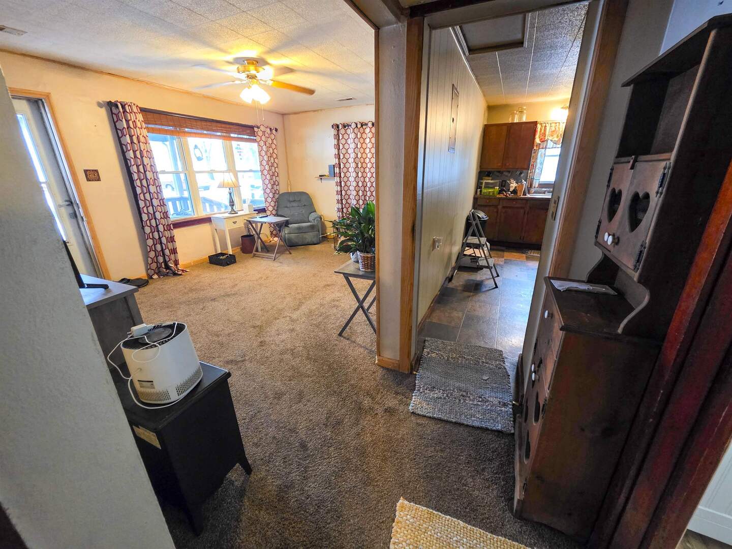 105 Watkins Street Cisne, IL 62823 - Photo 8 of 30 a view of a livingroom with furniture and a floor to ceiling window