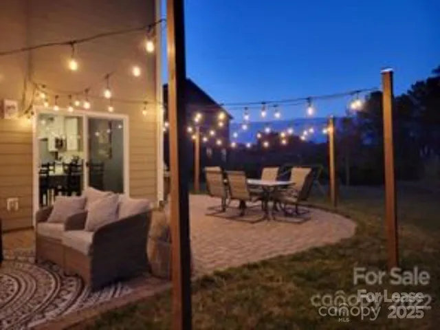 a view of a lobby with a couch and a potted plant