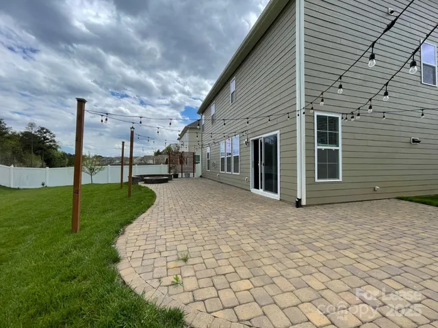a view of a backyard of the house