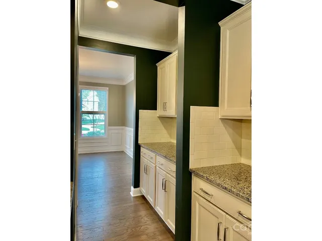 a view of a kitchen from an empty room