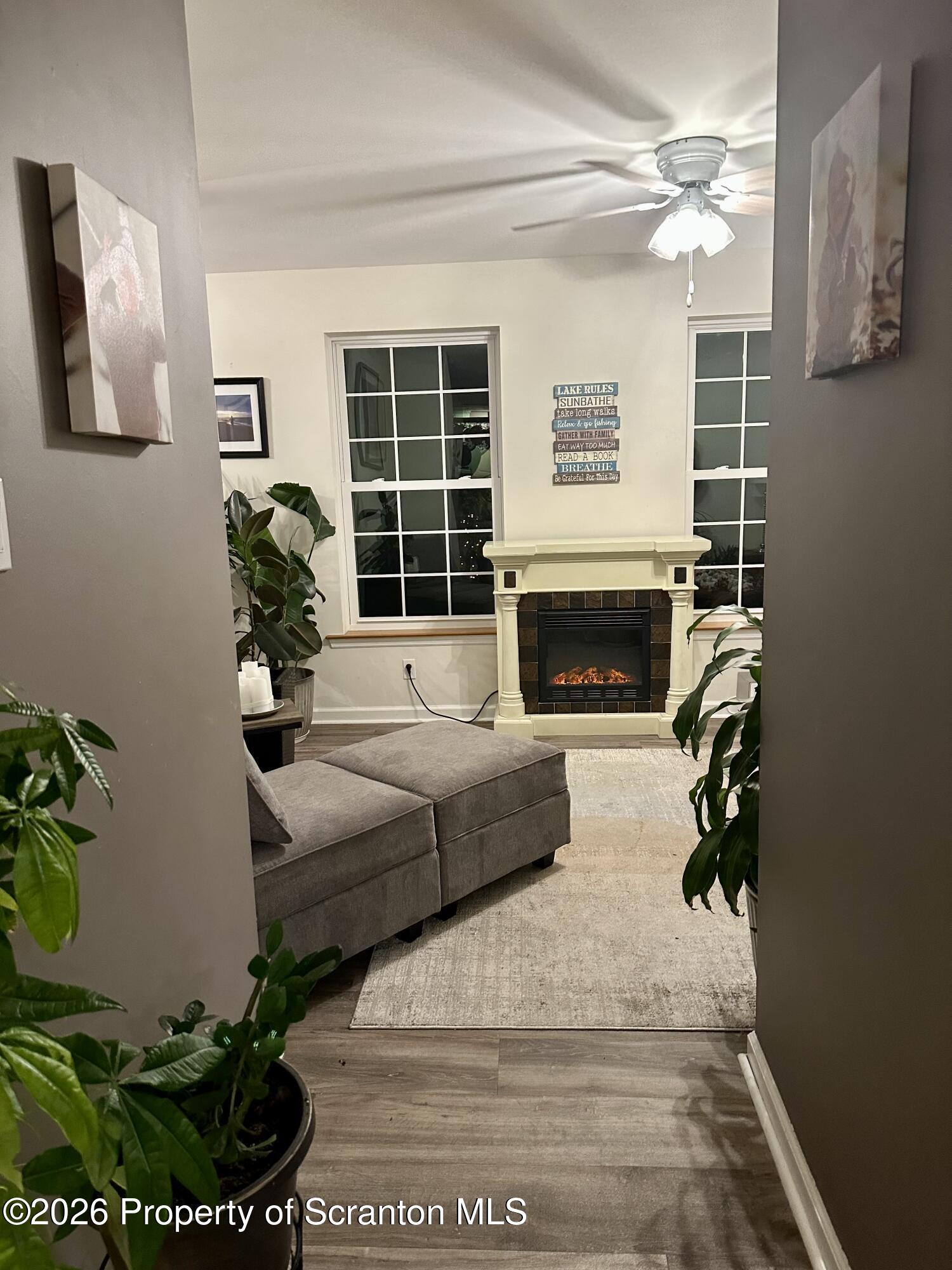 155 Baylor Road Nicholson, PA 18446 - Photo 31 of 53 a living room with furniture a fireplace and a potted plant