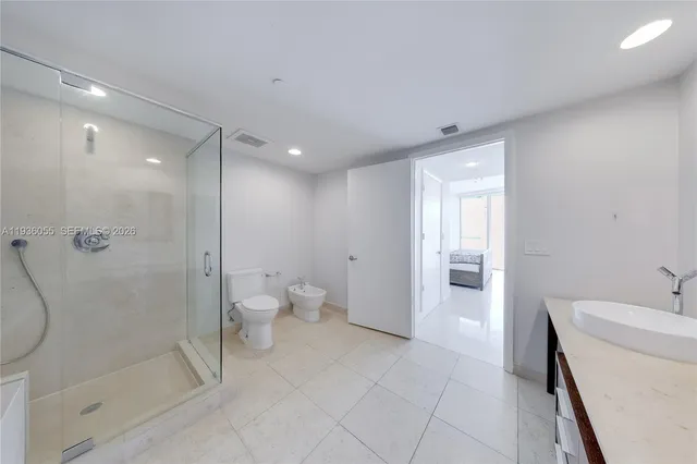 a bathroom with a shower and a toilet