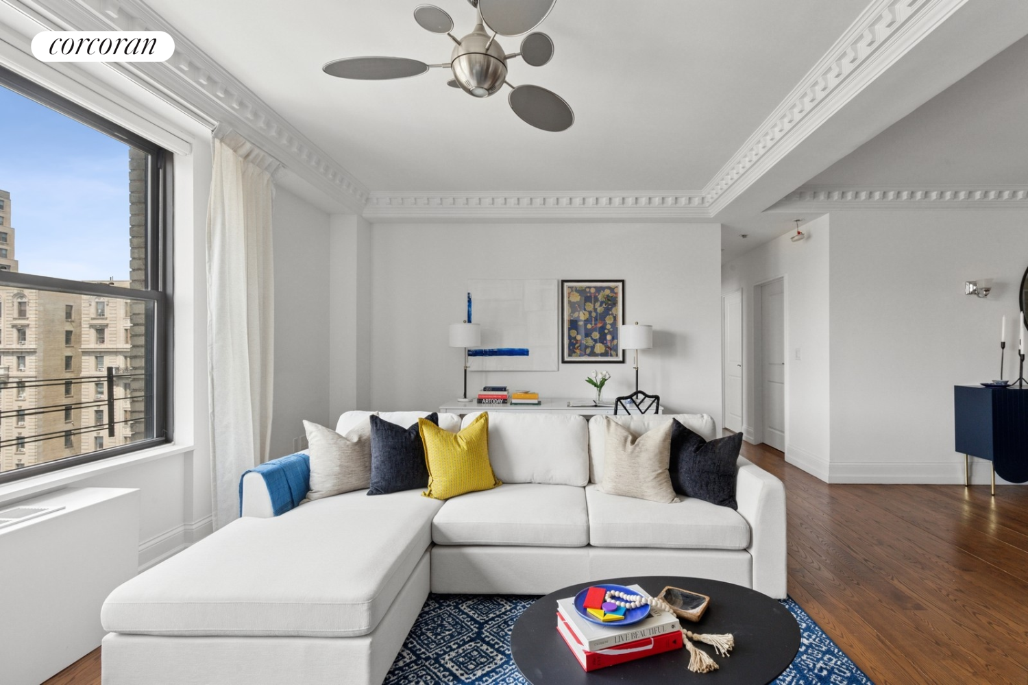215 West 91st Street, Unit 111 Manhattan, NY 10024 - Photo 3 of 11 a living room with furniture and a large window