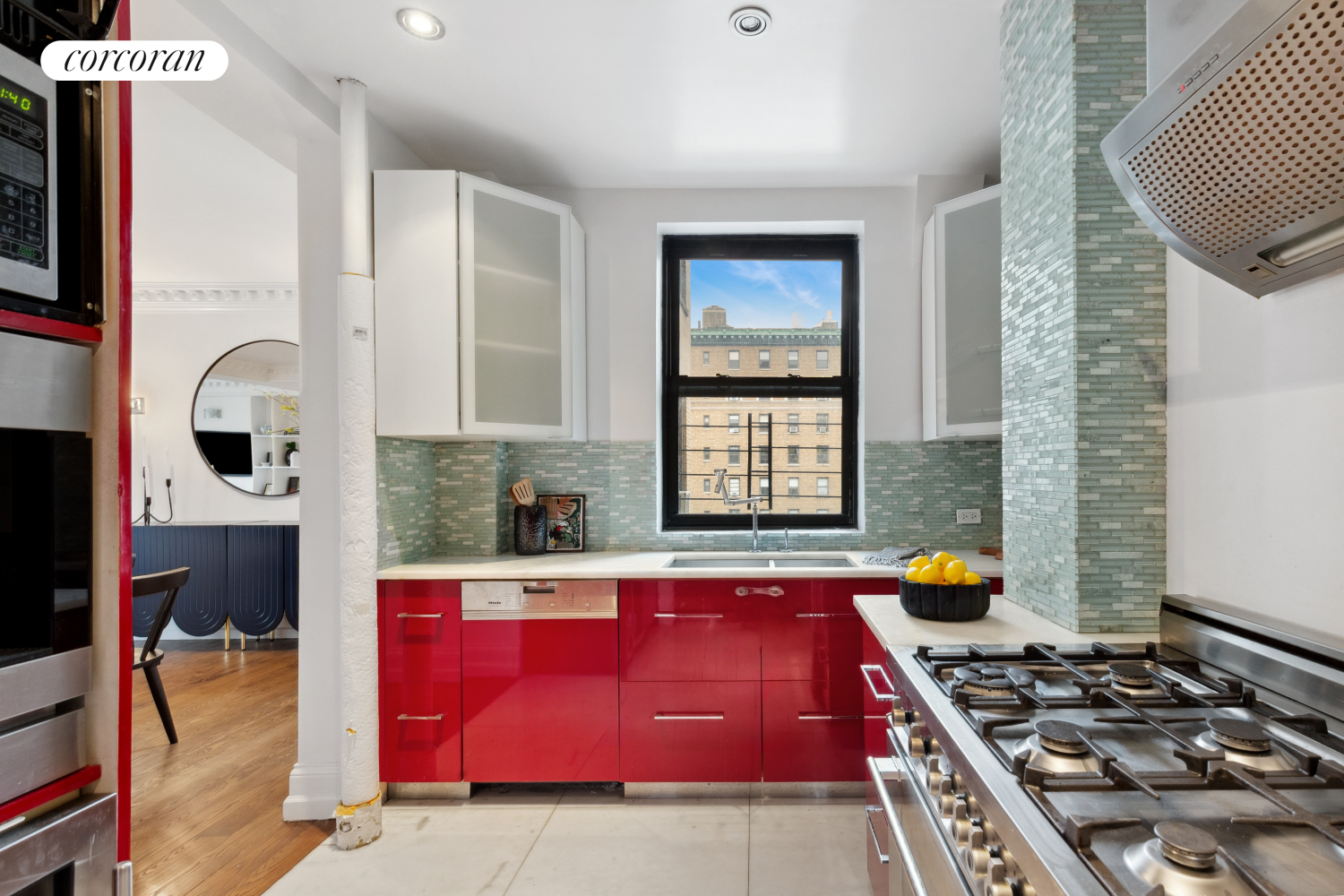 215 West 91st Street, Unit 111 Manhattan, NY 10024 - Photo 7 of 11 a kitchen with stainless steel appliances granite countertop a stove a sink and a microwave