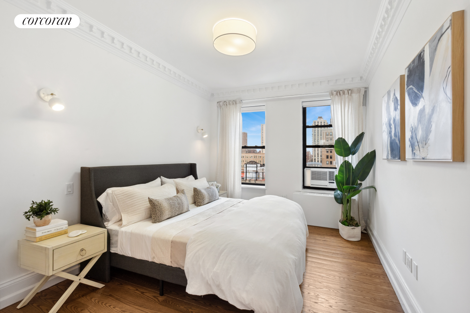 215 West 91st Street, Unit 111 Manhattan, NY 10024 - Photo 8 of 11 a bedroom with a bed and a couch