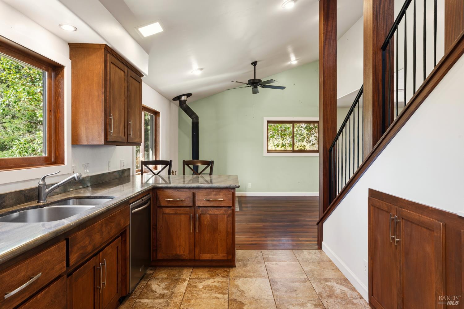 18210 Old Ukiah Pines Road Potter Valley, CA 95469 - Photo 13 of 43 a kitchen with a sink stove and cabinets