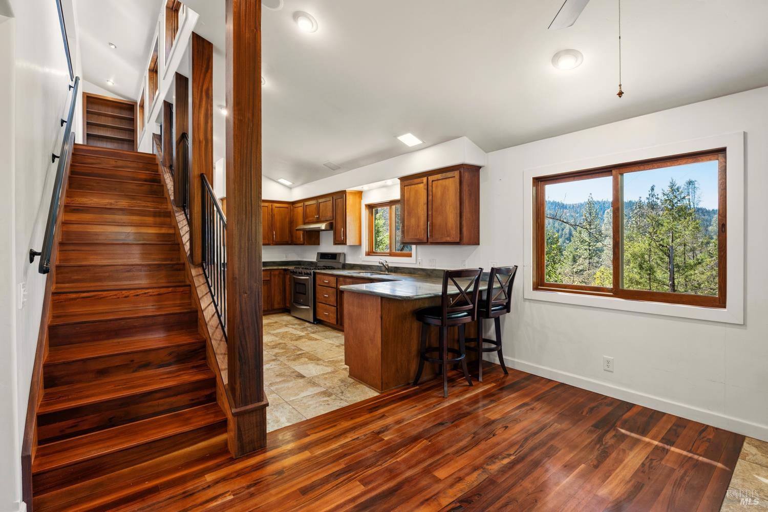 18210 Old Ukiah Pines Road Potter Valley, CA 95469 - Photo 15 of 43 a view of kitchen with furniture and wooden floor